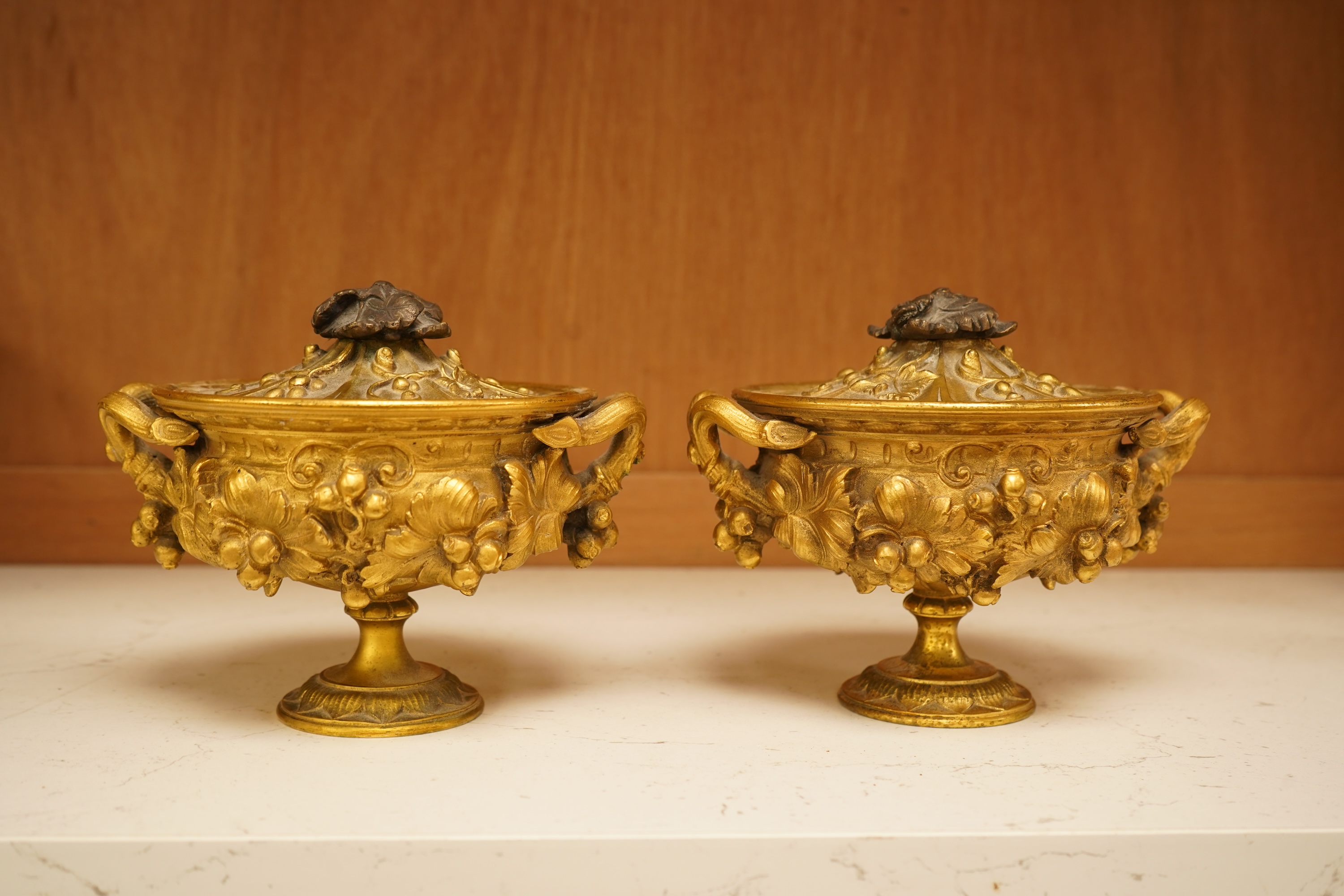 A pair of 19th century French ormolu lidded urns, 12cm